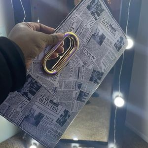 Read all about it! clutch purse